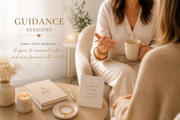 Two women in a warm setting during a guidance session with supportive messages and calming decor.