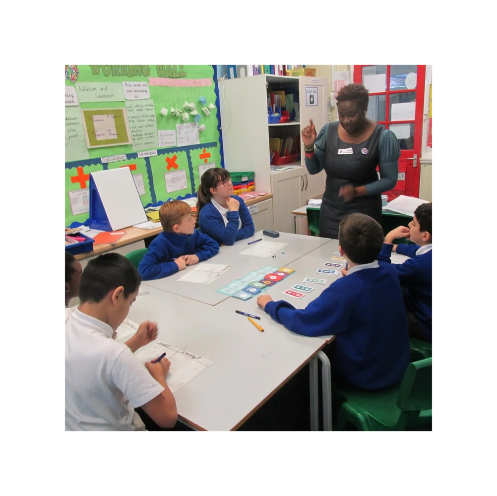 Teacher engaging students in a classroom activity.
