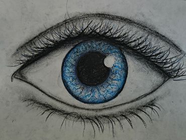 Detailed charcoal and blue colored pencil drawing of a human eye.