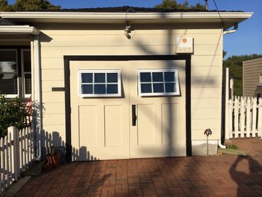 A white garage door, homemade.