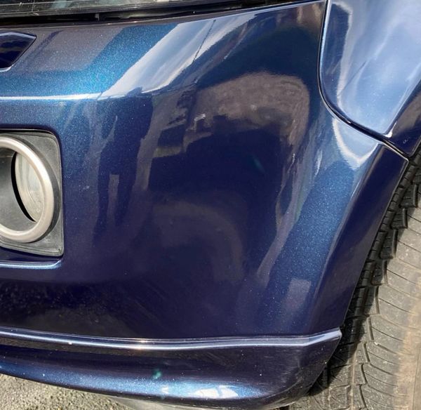 repaired bumper scuff on range rover blue glossy shiny