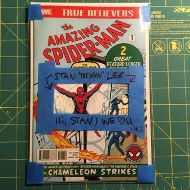 Marvel's Amazing Spider-Man comic with a special Stan Lee tribute frame taped on.