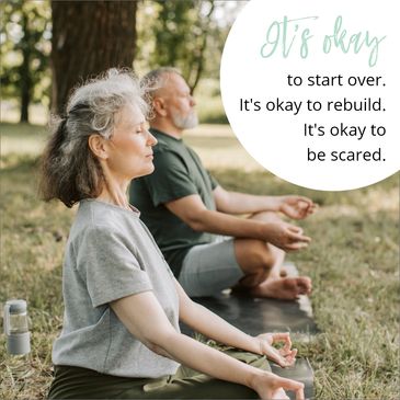 A couple meditating on the grass