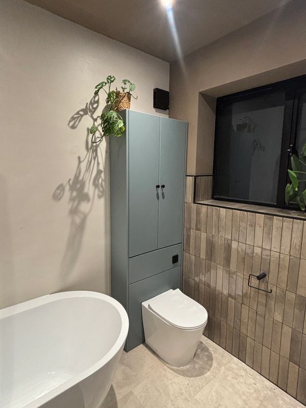 micro cement bathroom with warm natural artisan tiles leamington spa