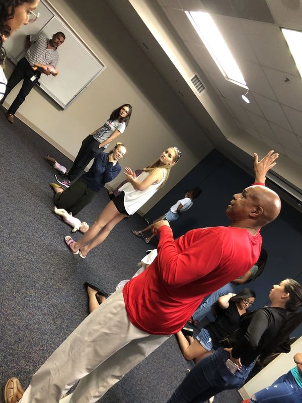 Group of people taking training session in a room