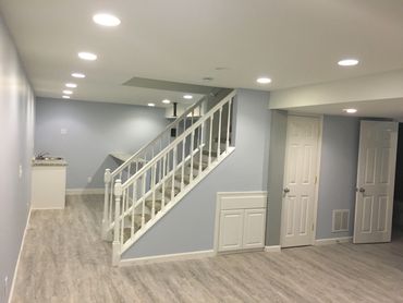 Fully finished basement with vinyl flooring, finished bedrooms, a bathroom and theatre room.