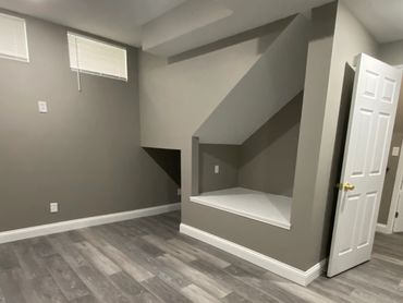 Basement reading nook (book nook) with recessed lighting.