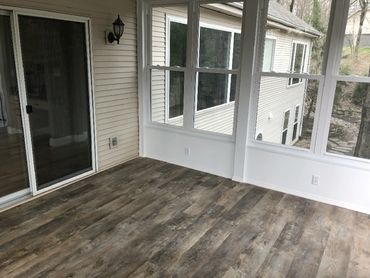 3 Season Room with a great view and luxury vinyl plank flooring.
