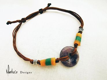 B450-1
Stones: Amethyst, African beads & Handmade silver from Laos. Waterproof Adjustable Bracelet.

