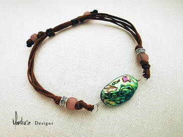 B450-3
Stones: Abalone Shell, African beads & Handmade silver from Laos. Waterproof Adjustable Brace
