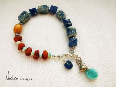 B705
Stones: Raw Blue kyanite, Rough Cut Agate, Amazonite & Lapis Lazuli & Mooakite.
Price: Egp 1600
