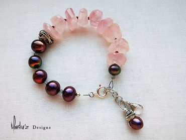 B711
Stones: Rose Quartz, Peacock Pearl, Labradorite & Garnet.
Price: Egp 2200