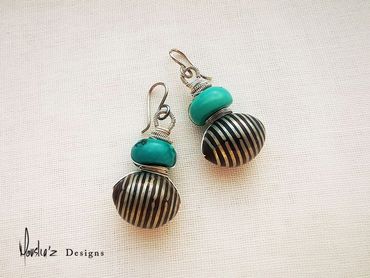 E438
Stones: Turquoise &  handmade Coke wood Inlaid with Silver.
Price: Egp 1400