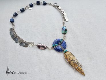 N735
Description:
Lapis Lazuli, Abalone Shell, Ocean Jasper & Turquoise.
Price: Egp 7000
