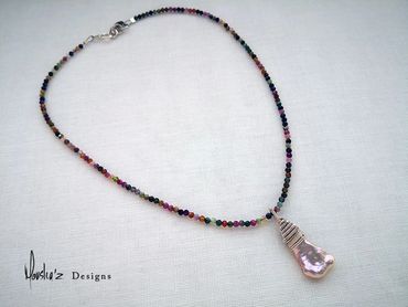 N805
Description:
Natural Shape Rose Pearl in a Multicolor Tourmaline Necklace.
Price: Egp 1300