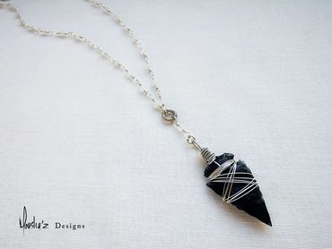N823
Description: Raw Black Obsidian Arrow Head & Moonstone.
Price: Egp 1900