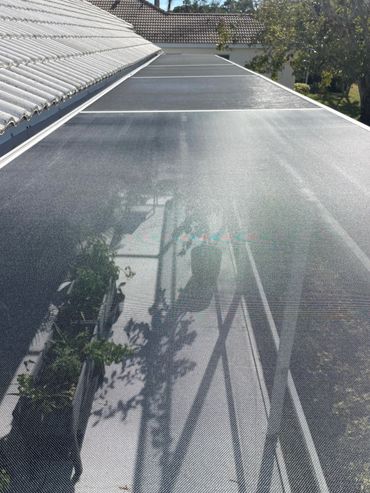 Replaced screen shade over a patio.