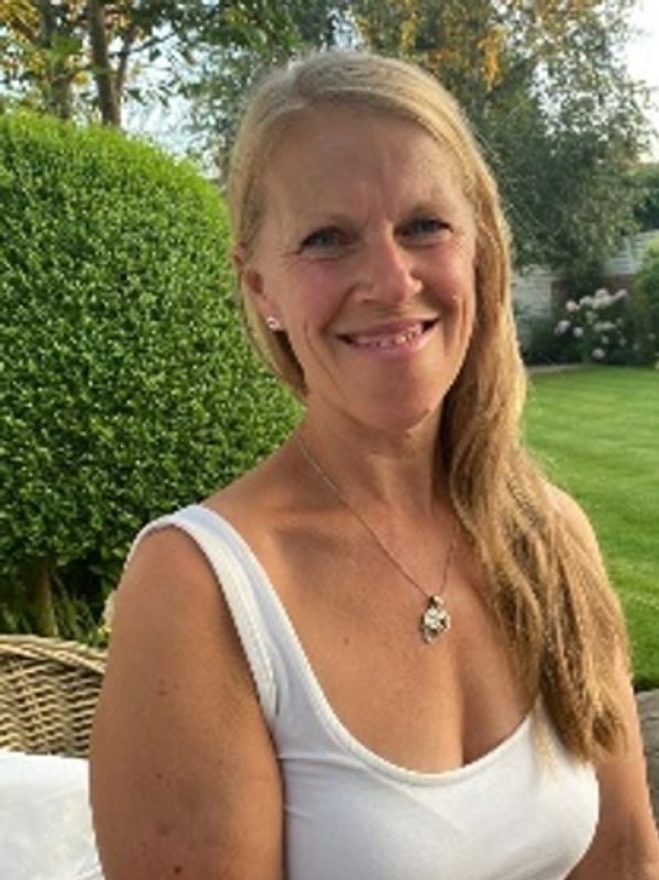 Female Yoga Teacher Smiling