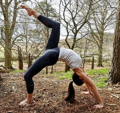 Leicester Yoga and Mindfulness coach in Bradgate Park, practicing her Wheel pose.