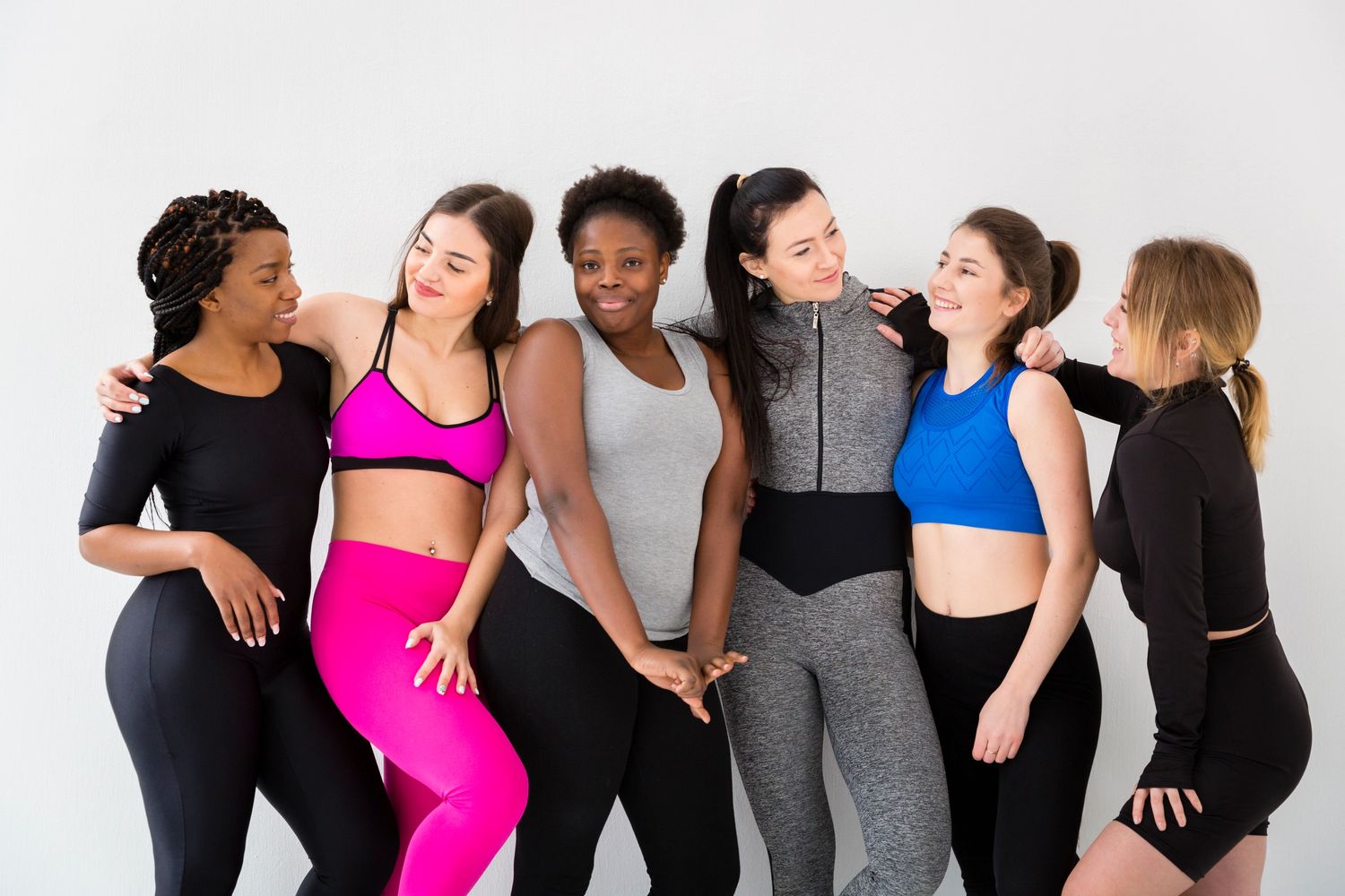 group of diverse women coming together to motivate each other in their individual journey