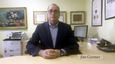 Jim Germer sitting at his desk.