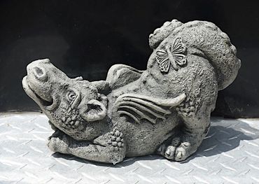 "Lil Dragon Butterfly"  Stone Garden sculpture.  Baby winged dragon with a butterfly."