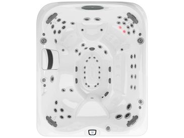 Top view of a modern white hot tub with multiple jets and seating areas.