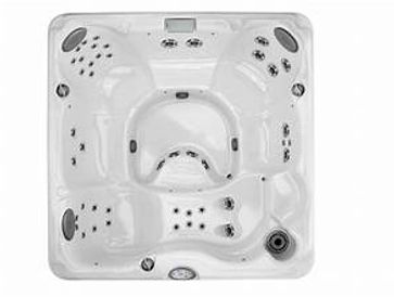 Top view of a white hot tub with multiple seats and jets.