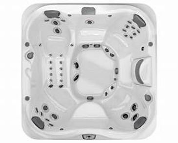 Top view of a white square hot tub with multiple seats and jets.