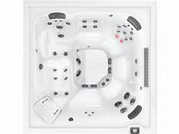 Top view of a white square hot tub with multiple jets and seats.