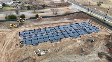 A construction site with foundation work and machinery.