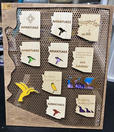 Hummingbirds, quail, owls, magnets on
Arizona display stand