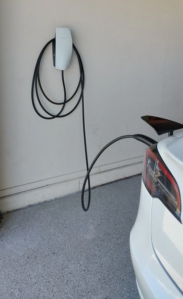 Tesla Wall Connector plugged into a Tesla charging at 60 amps. Phoenix AZ