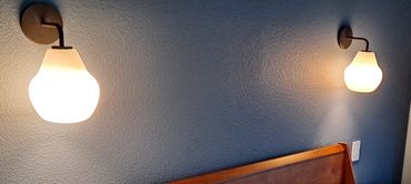 Bed side sconces on their own dimmer switches. Great idea for bedroom lighting.