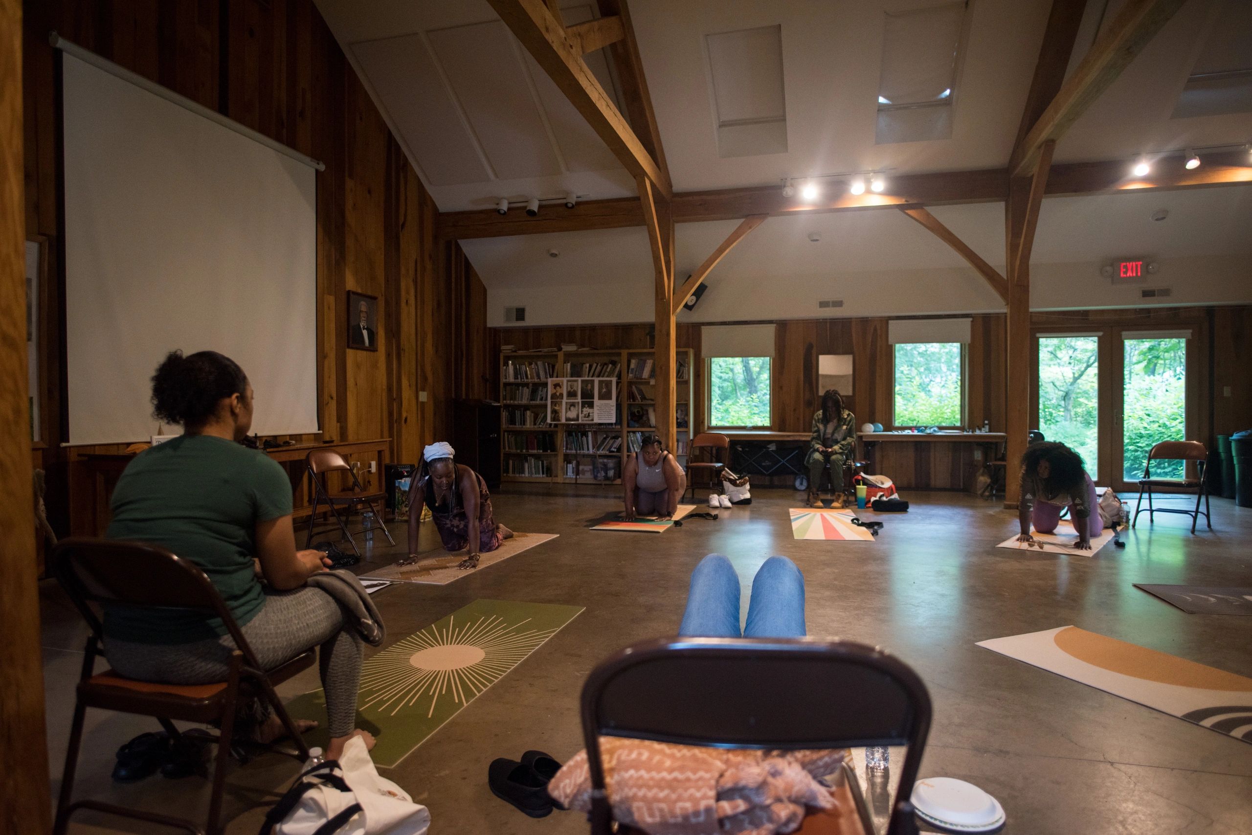 Group of Black mothers being guided through restorative embodiment practices in Albemarle County, Va