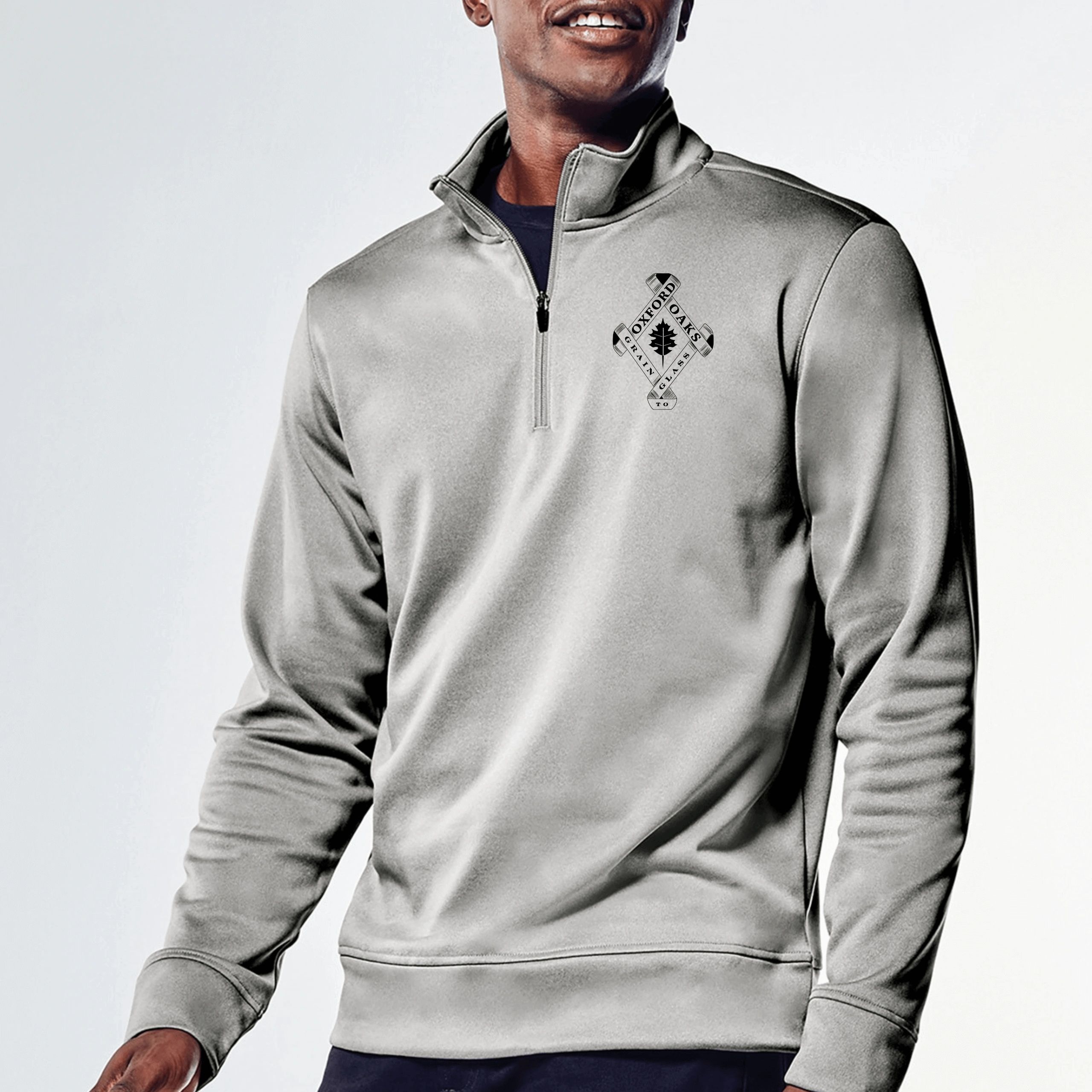 A stylish quarter-zip pullover in a sleek gray color featuring the Oxford Oaks Distillery logo.