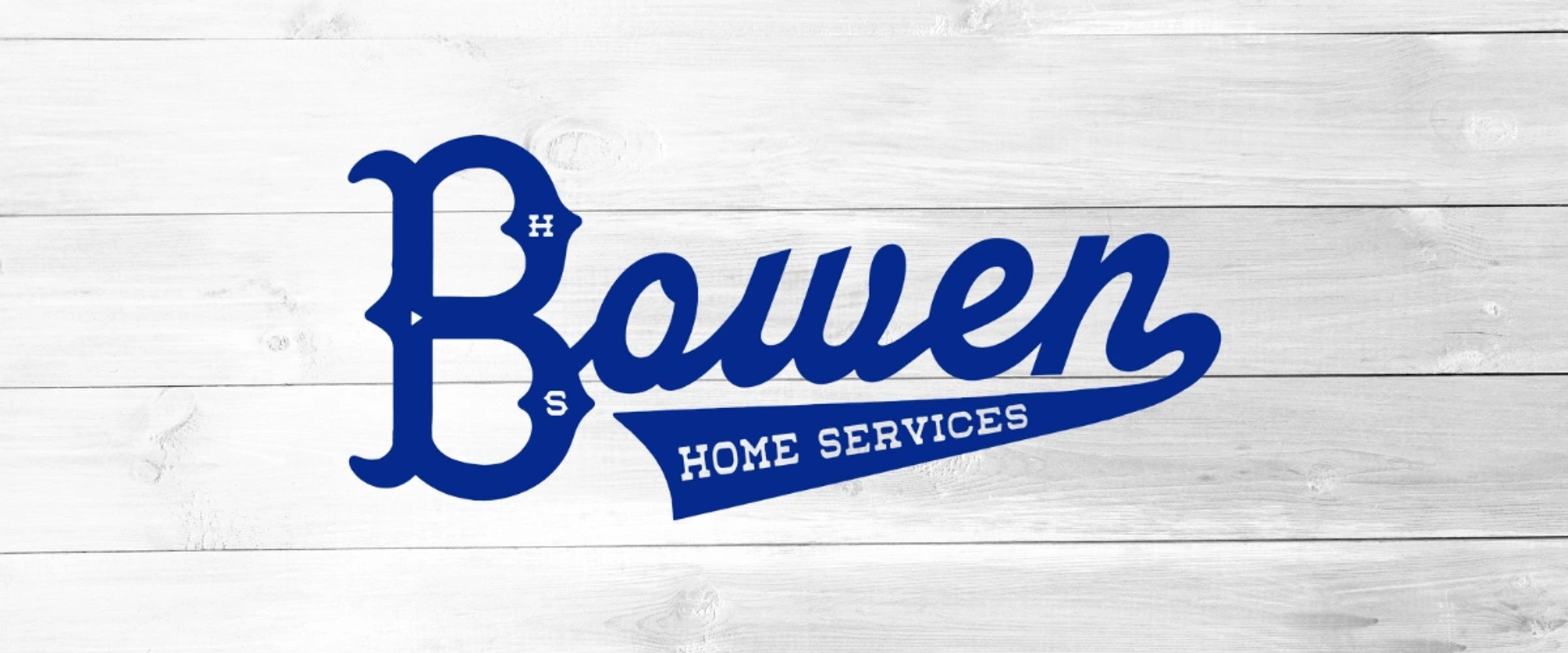 Blue Bowen Home Services logo on white wooden background.