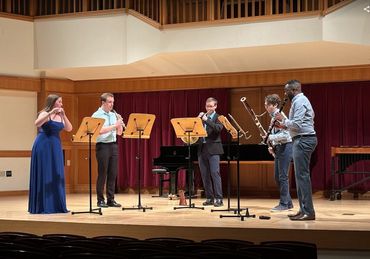 A wind quintet performs.