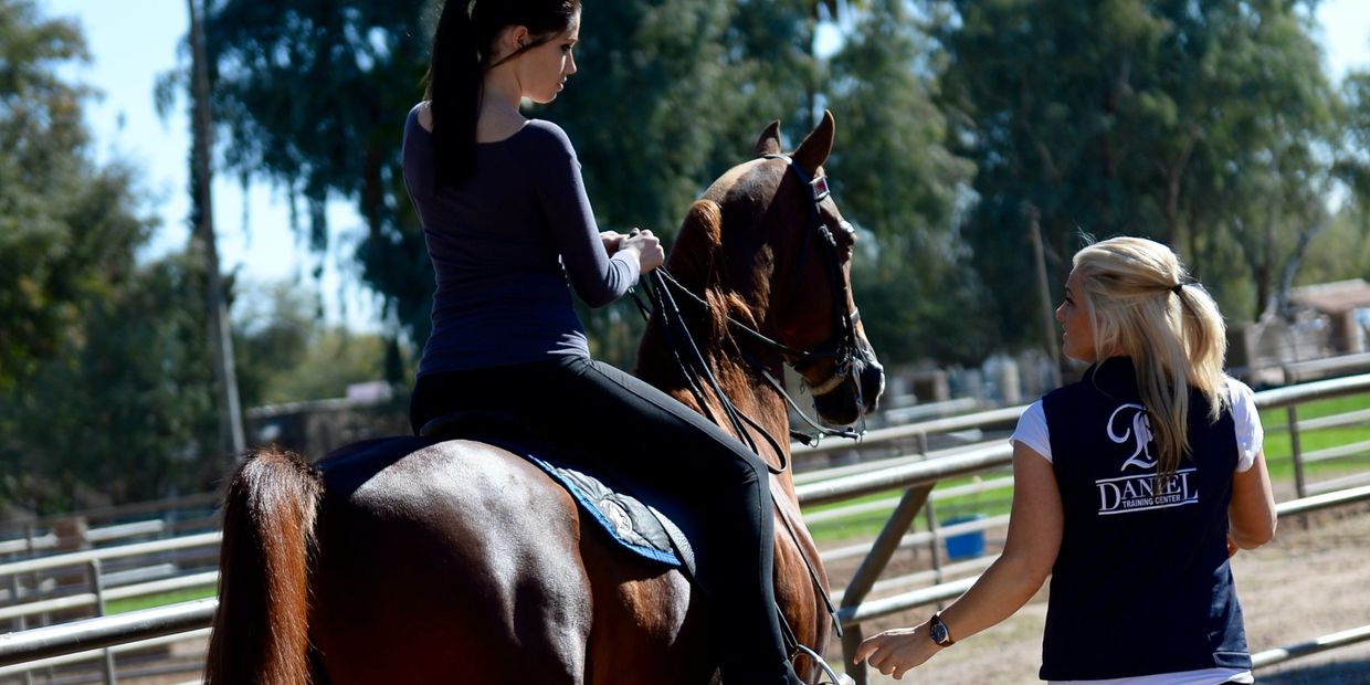 Giving a Riding horseback riding lesson