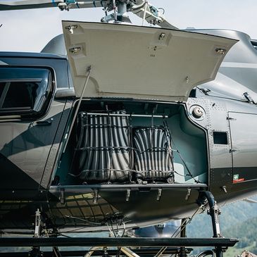 Open helicopter compartment showing equipment.