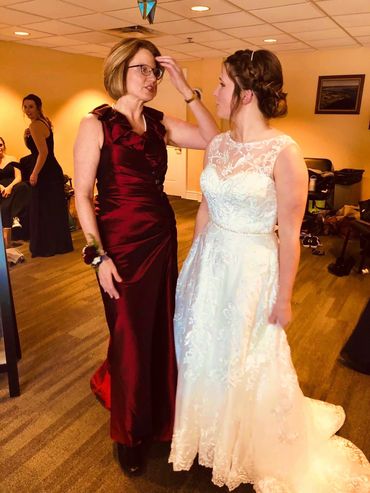 Two women wearing formal dresses