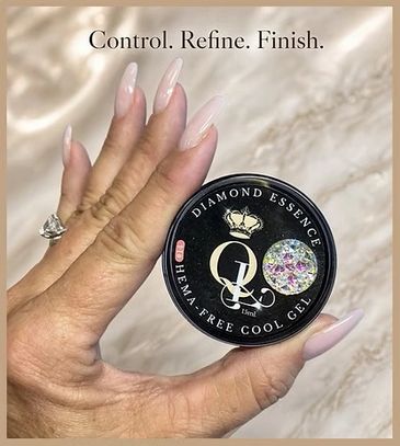 Hand holding a nail product jar with long, polished nails.
