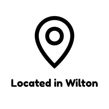 Map pin icon with the text 'Located in Wilton'.