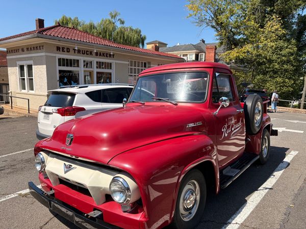 Vintage red truck parked near Red Truck Bakery.