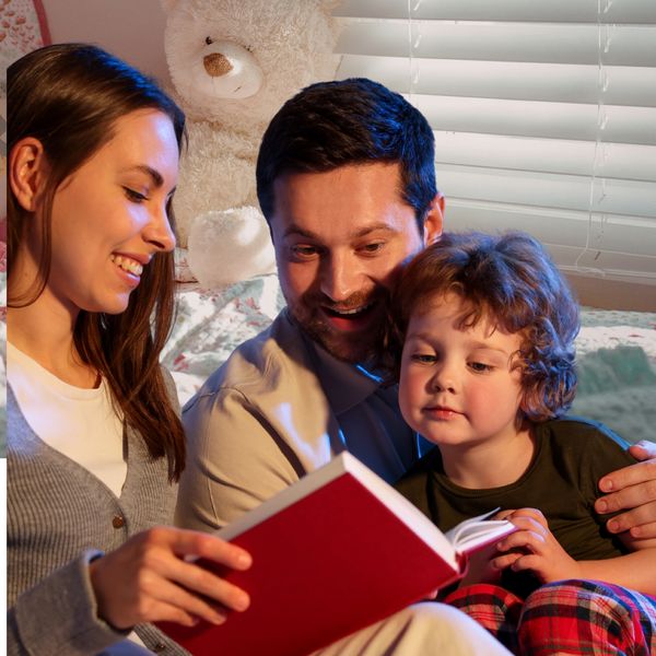 A family enjoys reading a book together before bedtime.