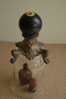 black 8 ball pool ball paired with antique metal foot made into a beautiful cloche