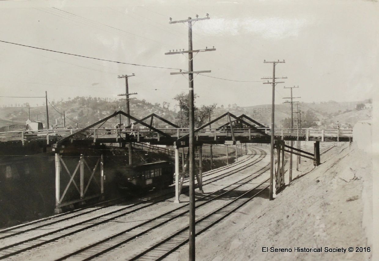 Looking west at old wood bridge over the Pacific Electric four-track line, at Harriman Ave, 1932.