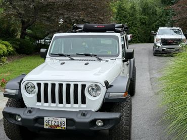 White Jeep with JT Armor on roof rack.
