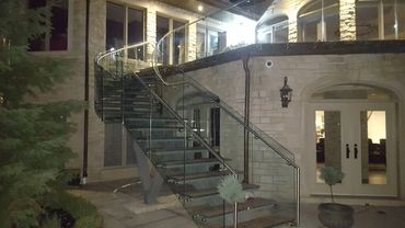 Residential Glass Railing, curve Glass Railing with round stainless steel handrail.
