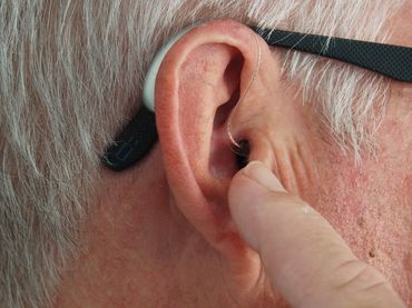 ASL can help bridge communication gaps for individuals with partial hearing.
